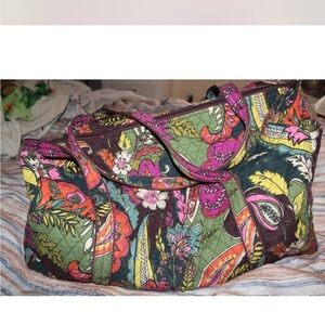 Super cute multicolored Vera Bradley duffle bag. Has a small pocket outside.